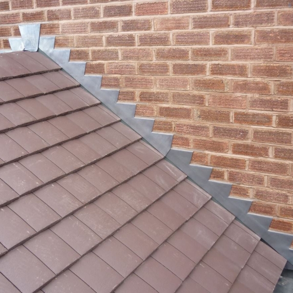 Roof Flashing: Critical Locations, Failure Signs, and Repairs 1 Metal roof flashing at a residential roof transition